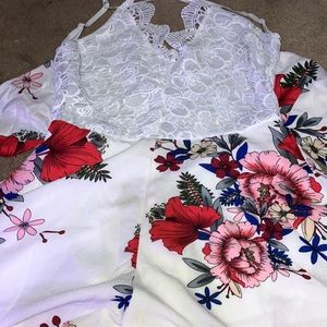 Brand is Shein. It’s a crochet lace floral print self-tie romper. White.
